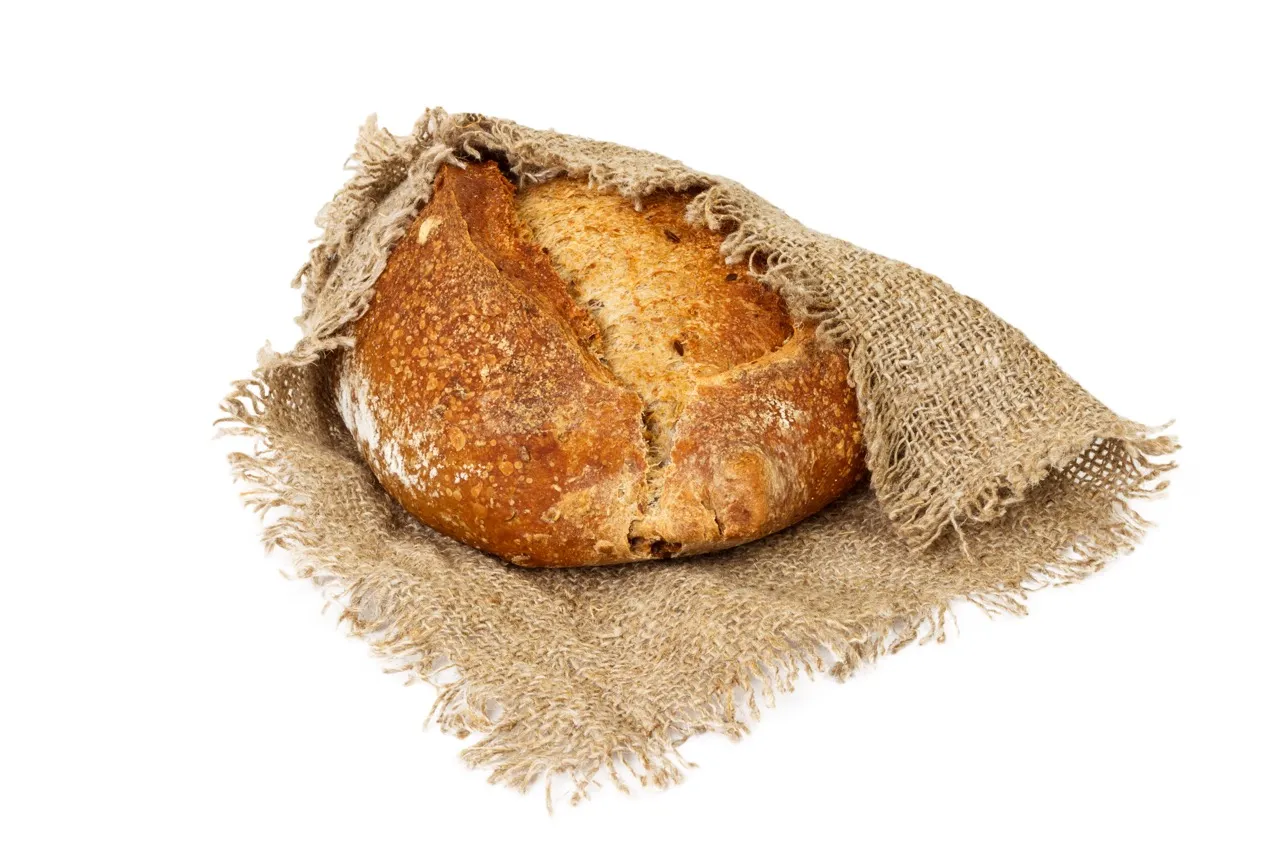 Rustic sourdough bread wrapped in burlap fabric 2026 01 08 22 04 20 utc groot